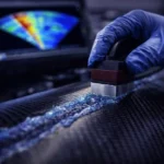 Ultrasonic Testing (UT): The Equipment Guide 5 Phased Array Ultrasonic Testing equipment scanning a composite aircraft wing for delamination.