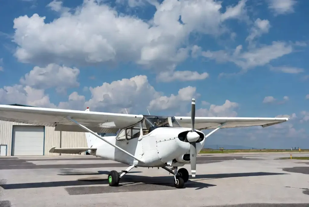 White Cessna 172 parked on sunny airport ramp – typical private aircraft insurance example